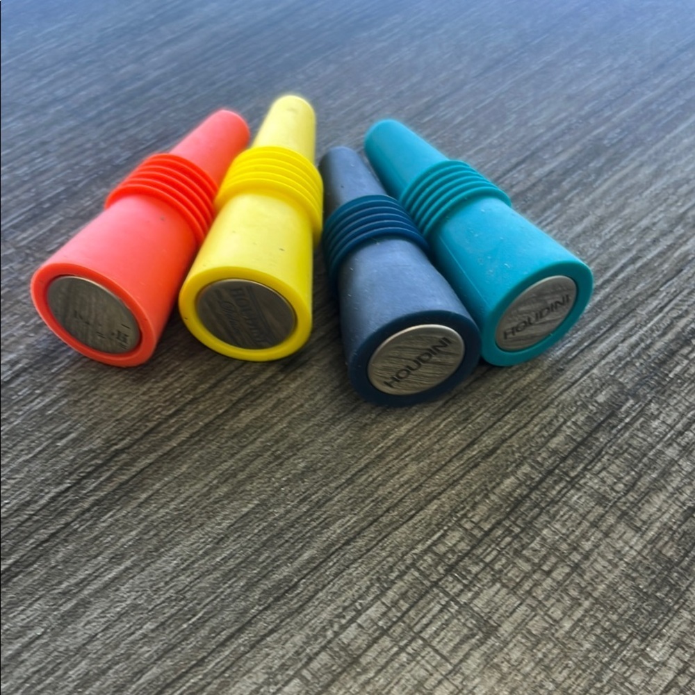 Set of 4 Colorful Houdini Silicone wine stoppers.